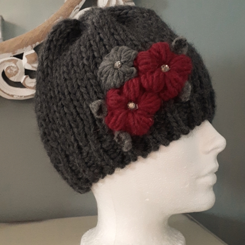 ^ Gelso Bianco grey knit beanie hat with floral accents